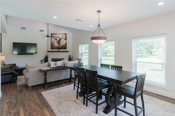 Dining room, Fireplace, Interior, Living room, Pendant Lights, Recessed Lighting, Wood Texture Flooring