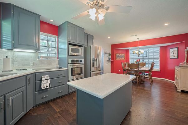Chandelier, Dining room, Interior, Kitchen, Pendant Lights, Recessed Lighting, Stainless Steel Appliances, Wood Texture Flooring