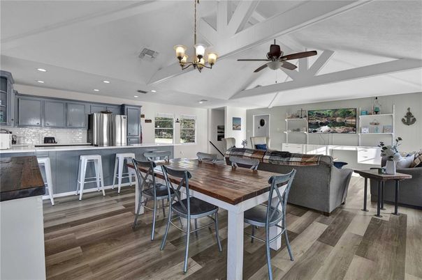 Chandelier, Dining room, Interior, Kitchen, Living room, Recessed Lighting, Stainless Steel Appliances, Wood Texture Flooring