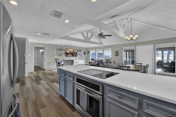 Chandelier, Dining room, Interior, Kitchen, Living room, Recessed Lighting, Stainless Steel Appliances, Wood Texture Flooring