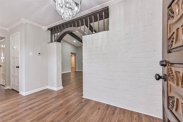 Chandelier, Empty room, Interior, Recessed Lighting, Stone Walls, Wood Texture Flooring
