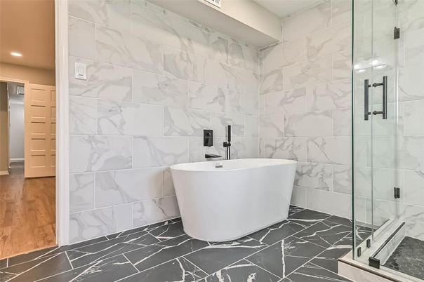 Bathroom, Free Standing Baths, Glass Shower, Interior, Marble, Marble Walls, Recessed Lighting, Wood Texture Flooring