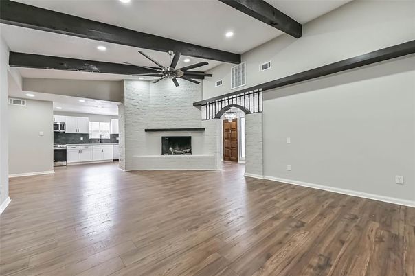 Empty room, Fireplace, Interior, Kitchen, Recessed Lighting, Wooden Beams, Wood Texture Flooring