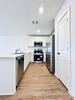 Interior, Kitchen, Recessed Lighting, Stainless Steel Appliances, Wood Texture Flooring