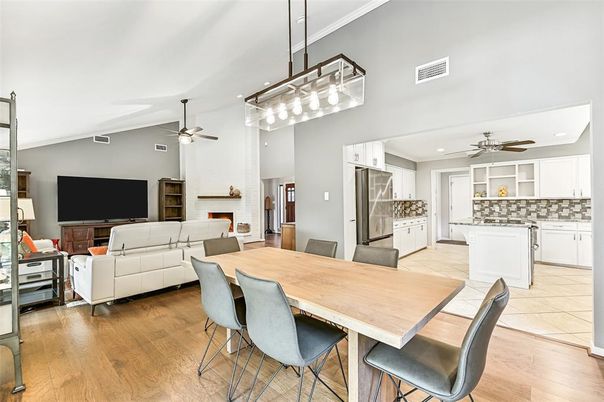 Dining room, Fireplace, Interior, Kitchen, Living room, Recessed Lighting, Stainless Steel Appliances, Stone Walls, Wood Texture Flooring