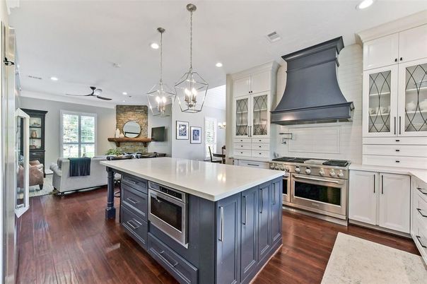 Fireplace, Interior, Kitchen, Living room, Pendant Lights, Recessed Lighting, Stainless Steel Appliances, Stone Walls, Wood Texture Flooring