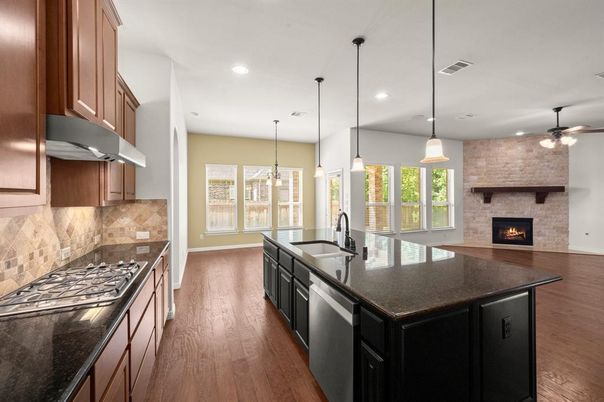 Fireplace, Interior, Kitchen, Pendant Lights, Recessed Lighting, Stone Walls, Wood Texture Flooring
