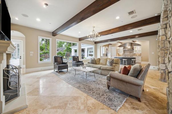 Chandelier, Fireplace, Interior, Living room, Recessed Lighting, Stone Walls, Wooden Beams