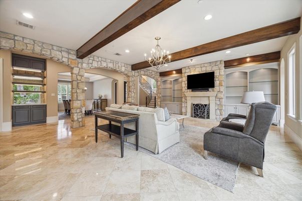 Chandelier, Fireplace, Interior, Living room, Recessed Lighting, Stone Walls, Wooden Beams