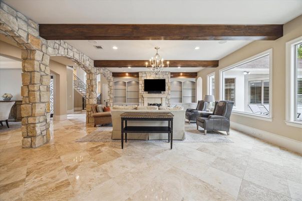 Chandelier, Fireplace, Interior, Living room, Recessed Lighting, Stone Walls, Wooden Beams