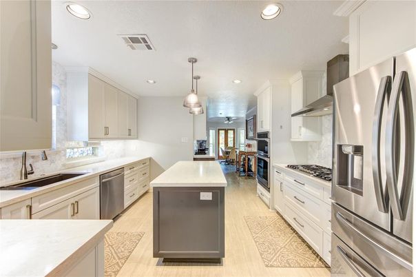 Dining room, Interior, Kitchen, Pendant Lights, Recessed Lighting, Stainless Steel Appliances, Wood Texture Flooring