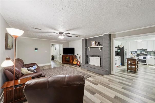 Fireplace, Interior, Kitchen, Living room, Pendant Lights, Stone Walls, Wood Texture Flooring