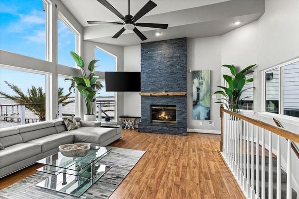 Fireplace, Interior, Living room, Recessed Lighting, Water, Wood Texture Flooring