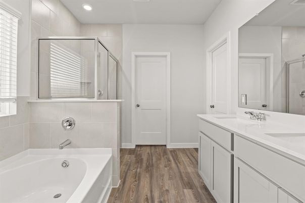 Bathroom, Dual Sink Vanities, Glass Shower, Interior, Recessed Lighting, Wood Texture Flooring