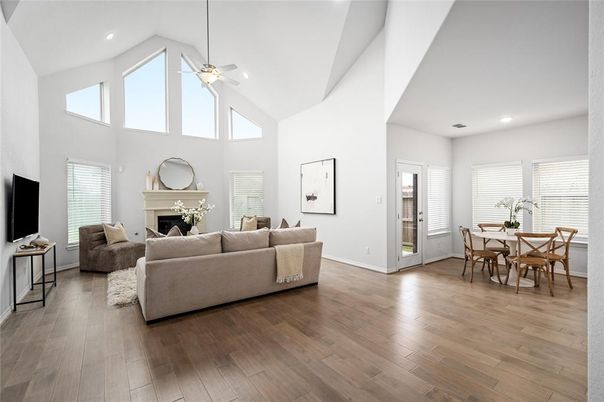 Dining room, Fireplace, Interior, Living room, Recessed Lighting, Wood Texture Flooring