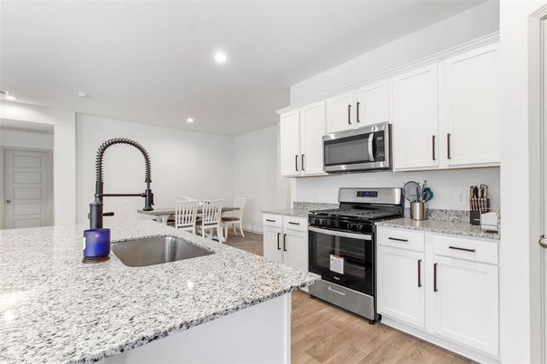 Dining room, Interior, Kitchen, Recessed Lighting, Stainless Steel Appliances, Wood Texture Flooring
