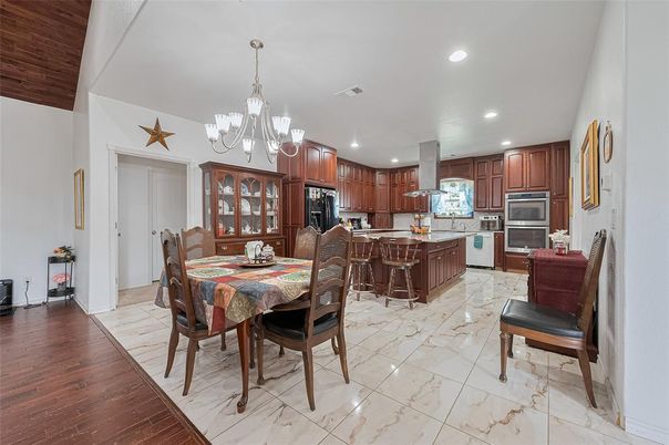 Chandelier, Dining room, Interior, Kitchen, Marble, Recessed Lighting, Stainless Steel Appliances, Wood Texture Flooring