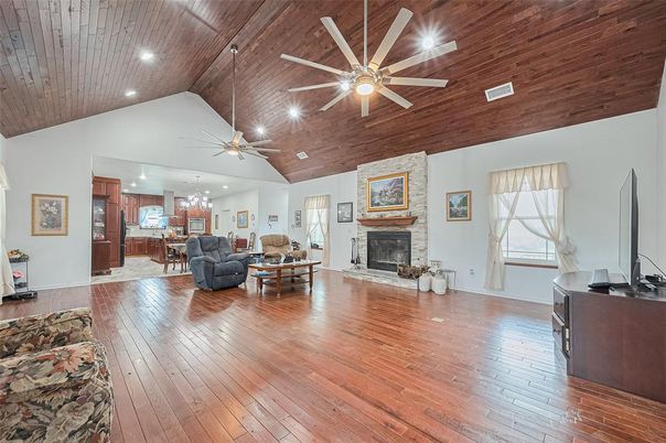 Chandelier, Dining room, Fireplace, Interior, Kitchen, Living room, Pendant Lights, Recessed Lighting, Wooden Ceilings, Wood Texture Flooring