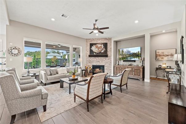 Fireplace, Interior, Living room, Recessed Lighting, Stone Walls, Wood Texture Flooring