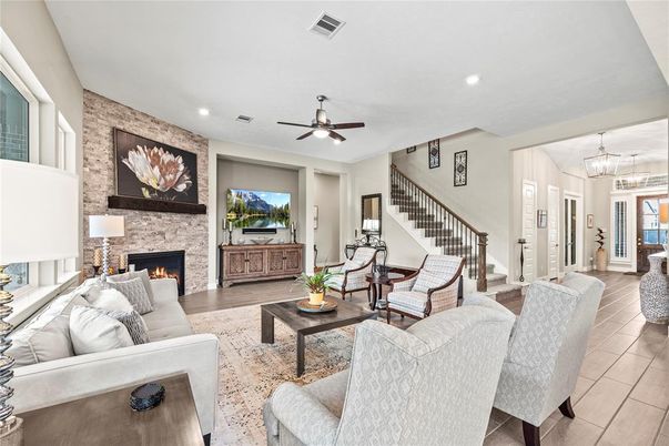 Fireplace, Interior, Living room, Recessed Lighting, Stone Walls, Wood Texture Flooring