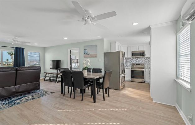 Dining room, Interior, Kitchen, Recessed Lighting, Stainless Steel Appliances, Wood Texture Flooring