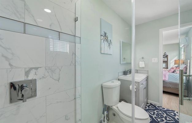Bathroom, Bedroom, Glass Shower, Interior, Marble, Marble Walls, Recessed Lighting, Wood Texture Flooring