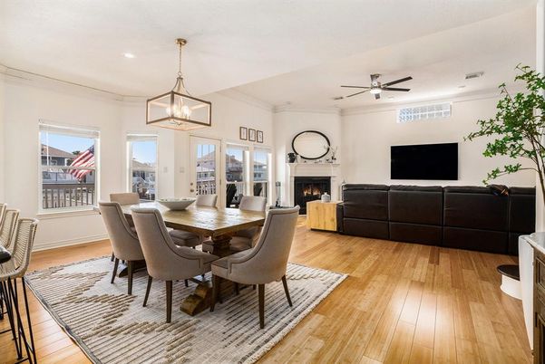 Dining room, Fireplace, Interior, Living room, Pendant Lights, Recessed Lighting, Wood Texture Flooring