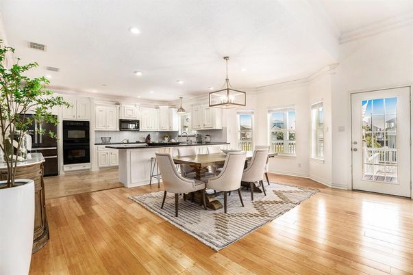 Dining room, Interior, Kitchen, Pendant Lights, Recessed Lighting, Stainless Steel Appliances, Wood Texture Flooring