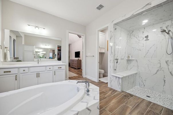 Bathroom, Dual Sink Vanities, Interior, Marble Walls, Recessed Lighting, Wood Texture Flooring