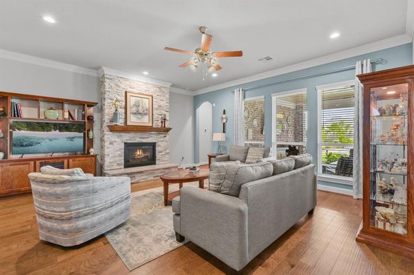 Fireplace, Interior, Living room, Recessed Lighting, Stone Walls, Wood Texture Flooring