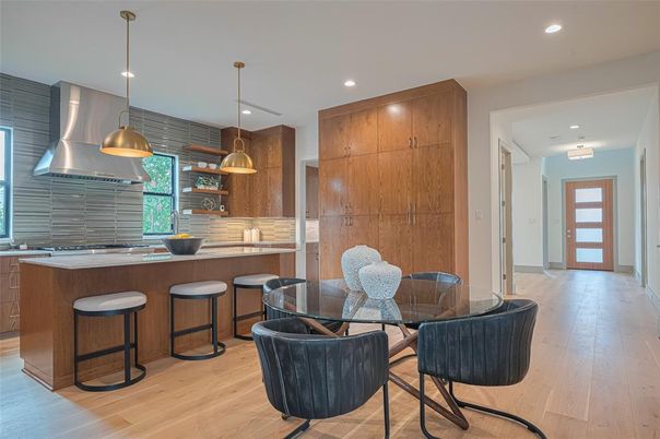 Dining room, Interior, Kitchen, Pendant Lights, Recessed Lighting, Stainless Steel Appliances, Wood Texture Flooring