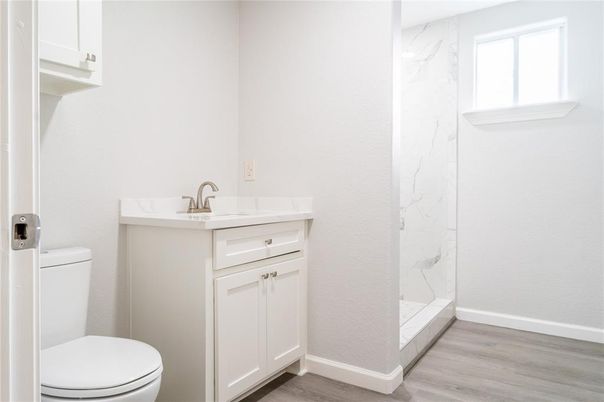Bathroom, Glass Shower, Interior, Marble Walls, Wood Texture Flooring