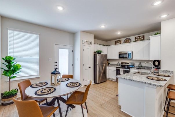 Dining room, Interior, Kitchen, Recessed Lighting, Stainless Steel Appliances, Wood Texture Flooring