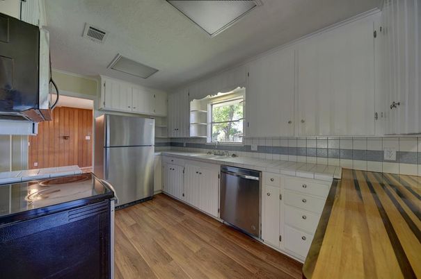 Interior, Kitchen, Stainless Steel Appliances, Tile Countertops, Wood Texture Flooring