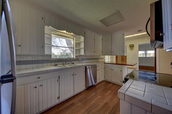 Interior, Kitchen, Stainless Steel Appliances, Tile Countertops, Wood Texture Flooring