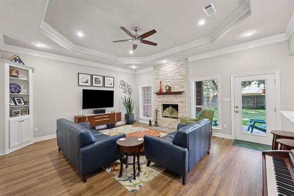 Fireplace, Interior, Living room, Piano, Recessed Lighting, Stone Walls, Wood Texture Flooring