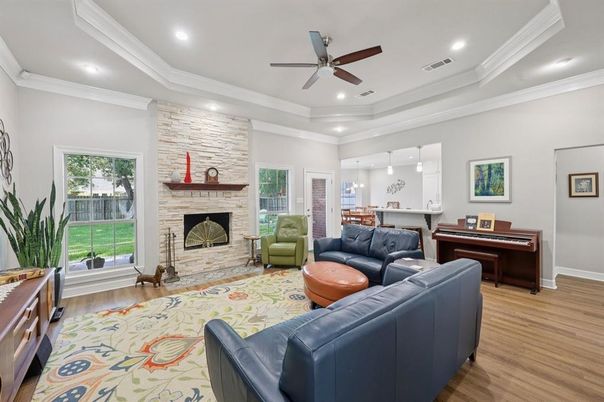Fireplace, Interior, Living room, Pendant Lights, Piano, Recessed Lighting, Stone Walls, Wood Texture Flooring