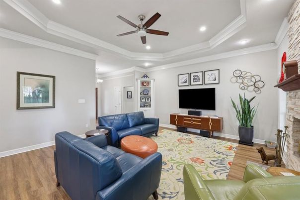 Fireplace, Interior, Living room, Recessed Lighting, Stone Walls, Wood Texture Flooring