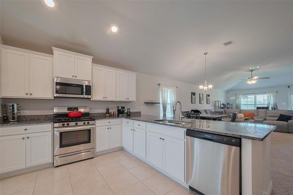 Chandelier, Dining room, Interior, Kitchen, Living room, Pendant Lights, Recessed Lighting, Stainless Steel Appliances