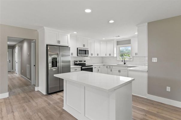 Interior, Kitchen, Recessed Lighting, Stainless Steel Appliances, Wood Texture Flooring