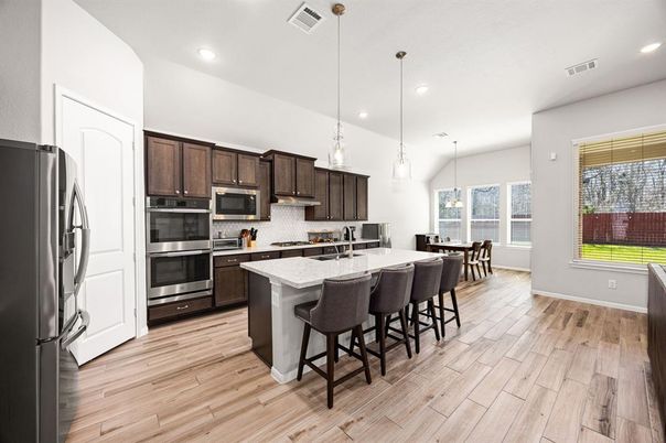 Dining room, Interior, Kitchen, Pendant Lights, Recessed Lighting, Stainless Steel Appliances, Wood Texture Flooring