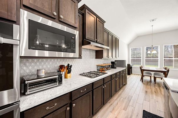Dining room, Interior, Kitchen, Pendant Lights, Stainless Steel Appliances, Wood Texture Flooring