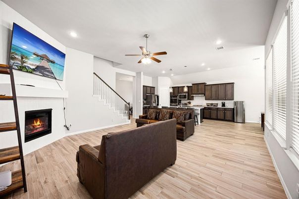 Fireplace, Interior, Kitchen, Living room, Recessed Lighting, Stainless Steel Appliances, Wood Texture Flooring