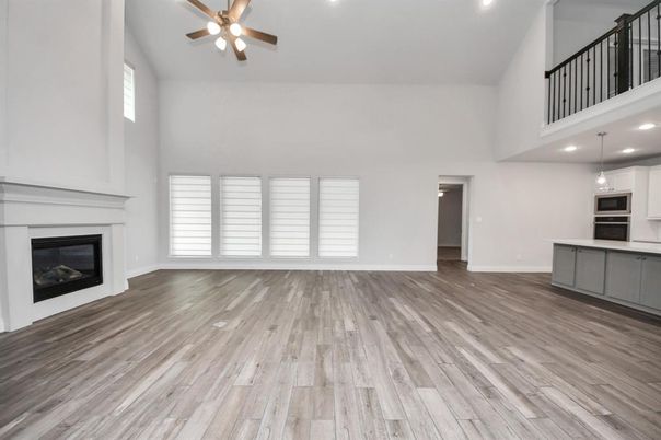 Empty room, Fireplace, Interior, Kitchen, Pendant Lights, Recessed Lighting, Wood Texture Flooring