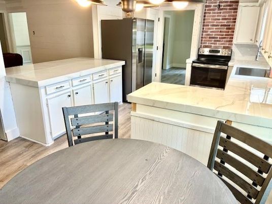 Interior, Kitchen, Stainless Steel Appliances, Stone Walls, Wood Texture Flooring