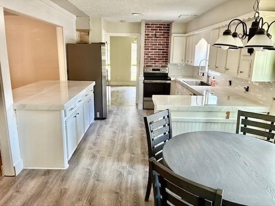 Chandelier, Dining room, Interior, Kitchen, Recessed Lighting, Stone Walls, Wood Texture Flooring