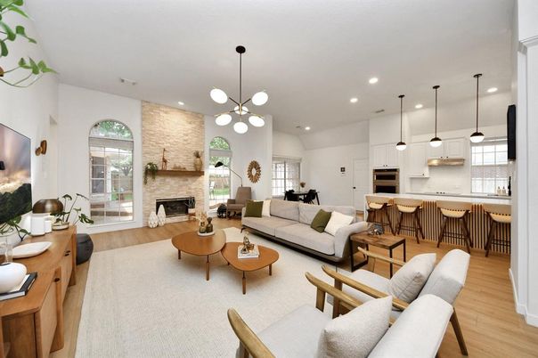 Fireplace, Interior, Kitchen, Living room, Pendant Lights, Recessed Lighting, Stainless Steel Appliances, Stone Walls, Wood Texture Flooring