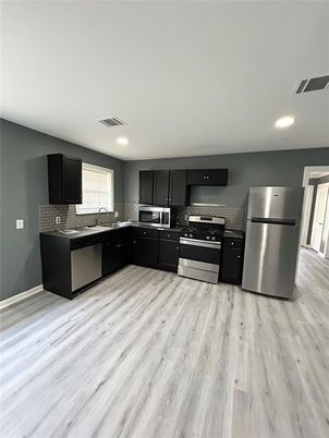 Interior, Kitchen, Recessed Lighting, Stainless Steel Appliances, Wood Texture Flooring