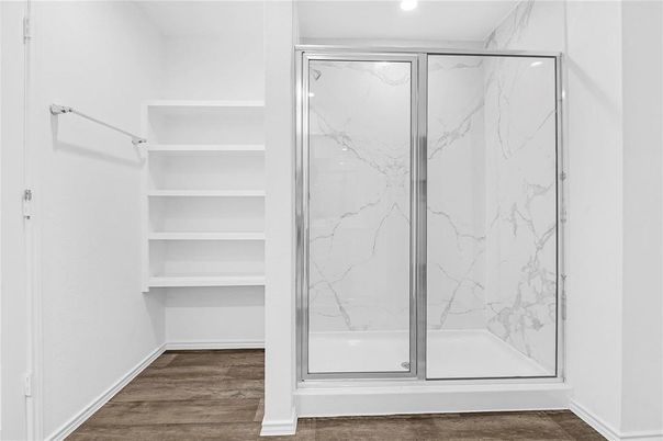 Bathroom, Glass Shower, Interior, Marble Walls, Recessed Lighting, Wood Texture Flooring