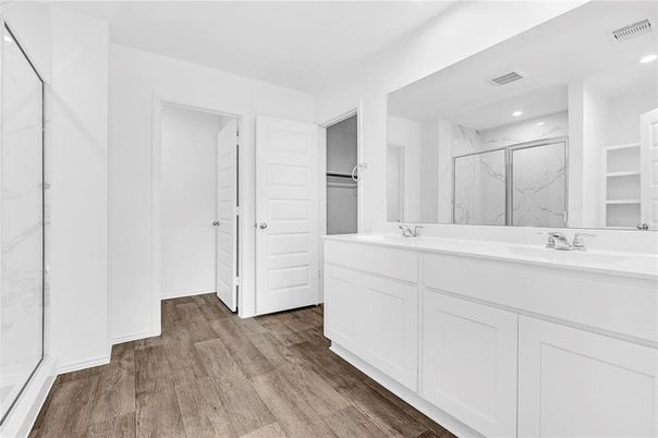 Bathroom, Dual Sink Vanities, Interior, Marble Walls, Recessed Lighting, Wood Texture Flooring